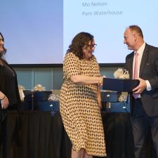 Retiree shakes hands with Superintendent