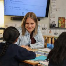 Teacher smiling at her student